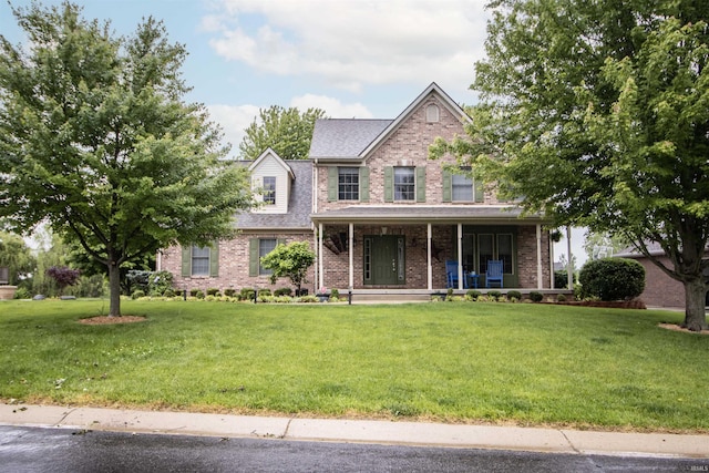 917 E Mill Creek Rd, Greensburg, IN 47240 - traditional-style home with brick siding, covered porch, and a front yard