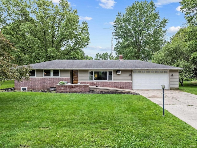 907 N Orchard Dr, North Manchester, IN 46962 - ranch-style home featuring a garage, concrete driveway, a front lawn, brick siding, and a chimney