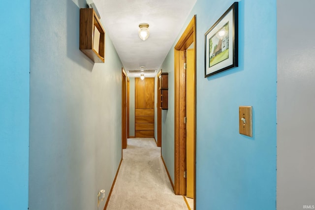 907 N Orchard Dr, North Manchester, IN 46962 - hallway with light colored carpet and baseboards