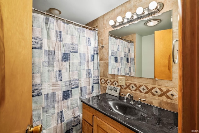 907 N Orchard Dr, North Manchester, IN 46962 - bathroom with vanity, backsplash, tile walls, and a shower with curtain