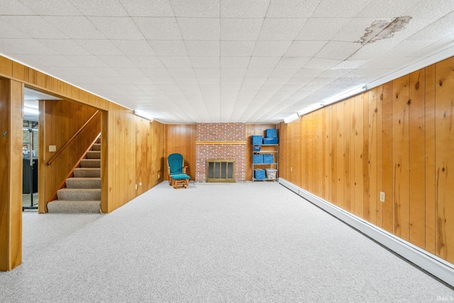 907 N Orchard Dr, North Manchester, IN 46962 - finished basement featuring a fireplace, carpet, wooden walls, and stairs