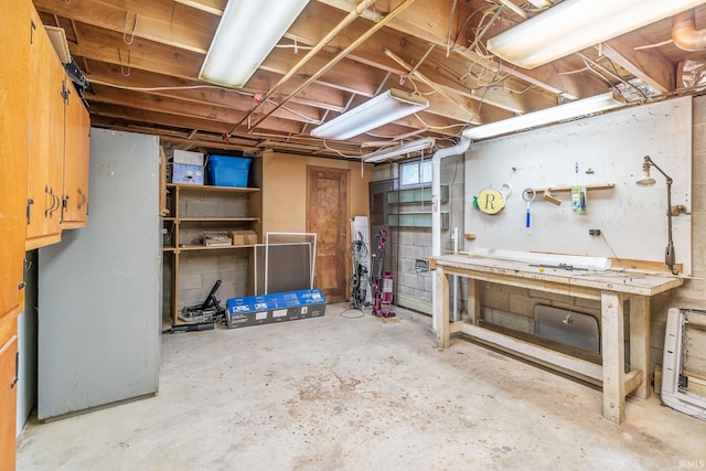907 N Orchard Dr, North Manchester, IN 46962 - unfinished below grade area with a workshop area