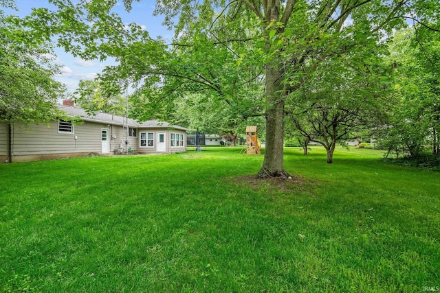 907 N Orchard Dr, North Manchester, IN 46962 - view of grassy yard featuring a playground