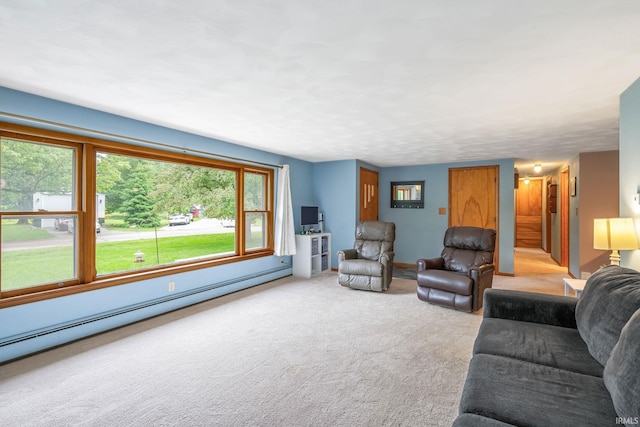 907 N Orchard Dr, North Manchester, IN 46962 - carpeted living room with a baseboard radiator