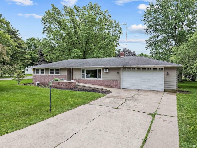 907 N Orchard Dr, North Manchester, IN 46962 - single story home featuring an attached garage, driveway, a front yard, and brick siding
