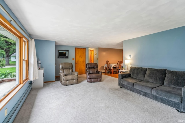 907 N Orchard Dr, North Manchester, IN 46962 - living room featuring a baseboard heating unit and carpet floors