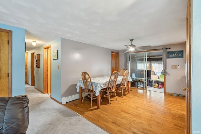 907 N Orchard Dr, North Manchester, IN 46962 - dining space with ceiling fan, wood finished floors, and baseboards