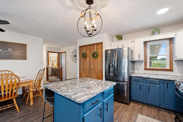 3705 E Forest Glen Ave, Leesburg, IN 46538 - kitchen with stainless steel refrigerator with ice dispenser, blue cabinets, dark wood-style flooring, a center island, and recessed lighting