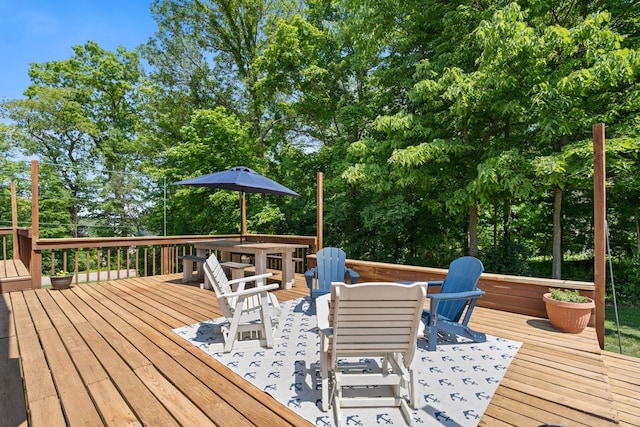 3705 E Forest Glen Ave, Leesburg, IN 46538 - wooden terrace featuring outdoor dining area and view of scattered trees