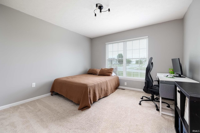 1154 S Deer Run, Ellettsville, IN 47429 - bedroom with baseboards, light carpet, and an office area