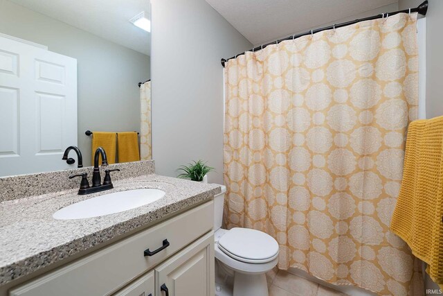 1154 S Deer Run, Ellettsville, IN 47429 - full bathroom featuring vanity, toilet, and tile patterned floors