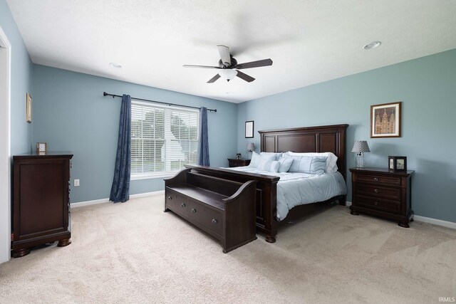 1154 S Deer Run, Ellettsville, IN 47429 - bedroom featuring light carpet, baseboards, and ceiling fan