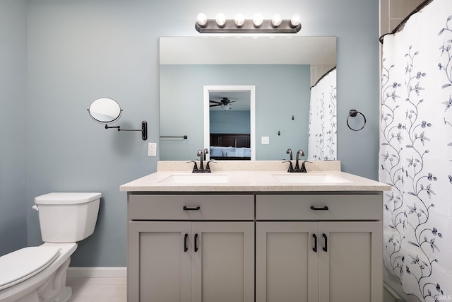 1154 S Deer Run, Ellettsville, IN 47429 - full bath featuring a ceiling fan, double vanity, toilet, and ensuite bathroom