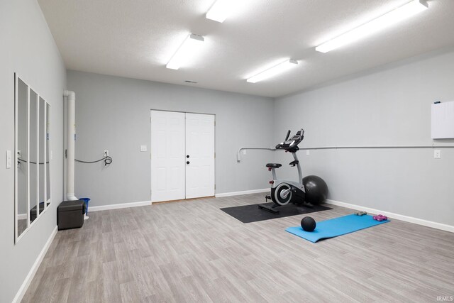 1154 S Deer Run, Ellettsville, IN 47429 - workout room with wood finished floors and baseboards