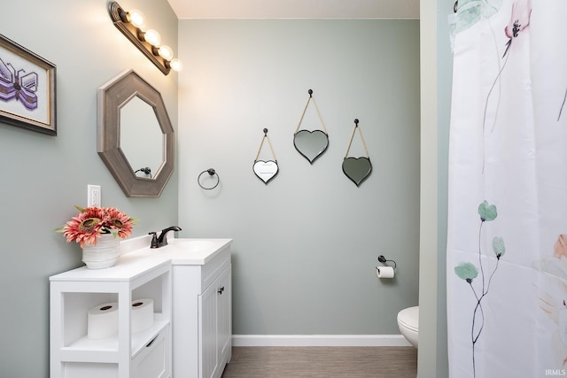 1154 S Deer Run, Ellettsville, IN 47429 - full bathroom featuring vanity, toilet, baseboards, wood finished floors, and curtained shower