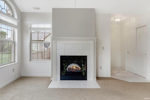 5248 Coventry Ln, Fort Wayne, IN 46804 - unfurnished living room featuring carpet floors, a tile fireplace, and baseboards