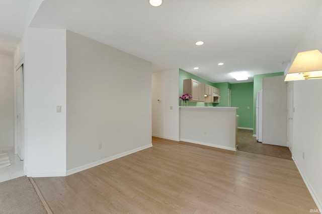 5248 Coventry Ln, Fort Wayne, IN 46804 - unfurnished living room with light wood-style flooring, recessed lighting, and baseboards