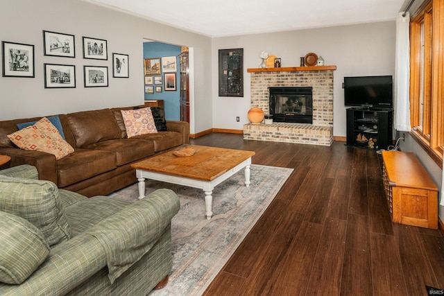 4641 W Harvest Ln, Bloomington, IN 47404 - living room featuring wood finished floors, a fireplace, and baseboards