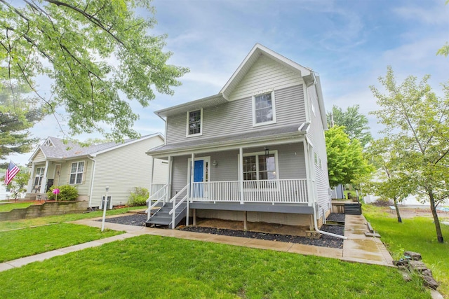 513 W Russ Ave, Mishawaka, IN 46545 - view of front of home featuring covered porch and a front yard