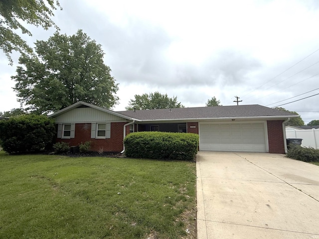 1105 E Southway Blvd, Kokomo, IN 46902 - ranch-style home featuring brick siding, a garage, concrete driveway, and a front yard