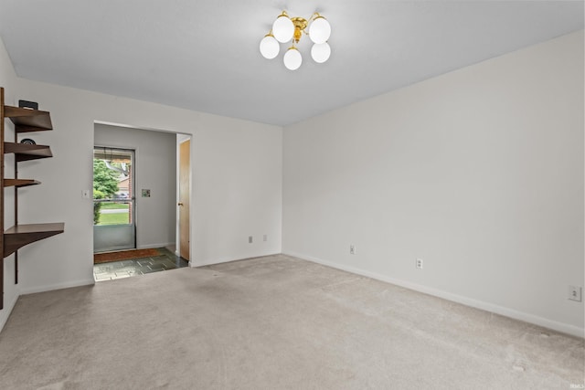 1105 E Southway Blvd, Kokomo, IN 46902 - empty room with carpet flooring, baseboards, and a chandelier
