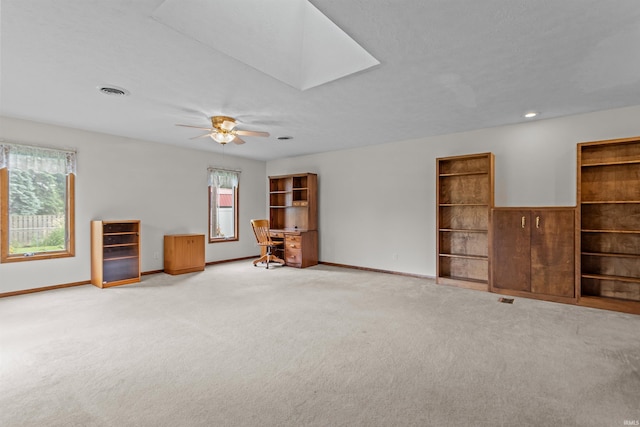 1105 E Southway Blvd, Kokomo, IN 46902 - unfurnished living room with carpet floors, baseboards, and a ceiling fan