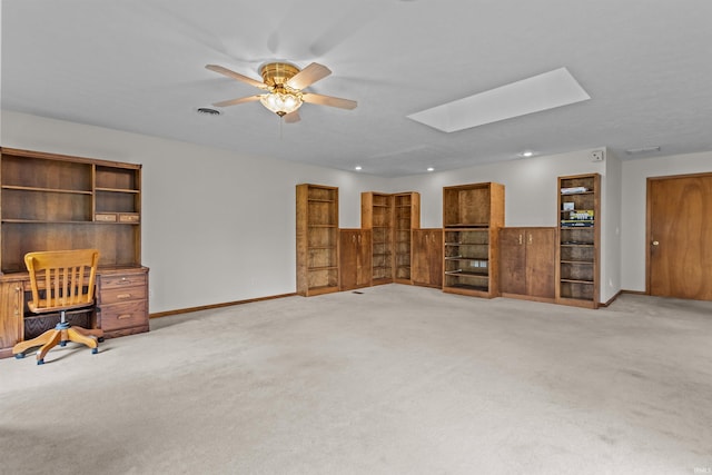 1105 E Southway Blvd, Kokomo, IN 46902 - unfurnished living room featuring carpet flooring, a skylight, a ceiling fan, an office area, and recessed lighting