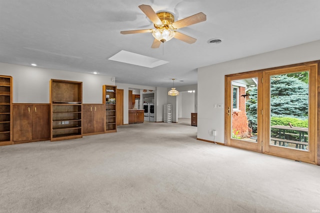 1105 E Southway Blvd, Kokomo, IN 46902 - unfurnished living room featuring carpet, a skylight, and a ceiling fan