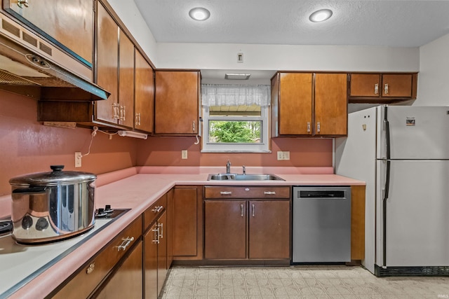 1105 E Southway Blvd, Kokomo, IN 46902 - kitchen featuring stainless steel dishwasher, freestanding refrigerator, a sink, exhaust hood, and light countertops