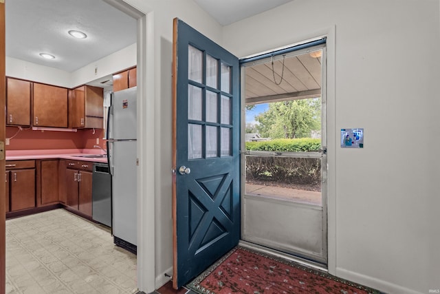 1105 E Southway Blvd, Kokomo, IN 46902 - doorway featuring a sink, light floors, and baseboards