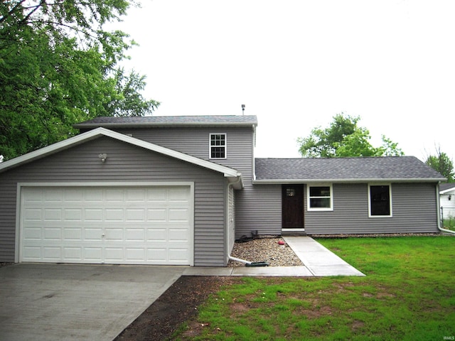 25123 Snyder St, Elkhart, IN 46514 - traditional-style house with driveway, an attached garage, and a front yard