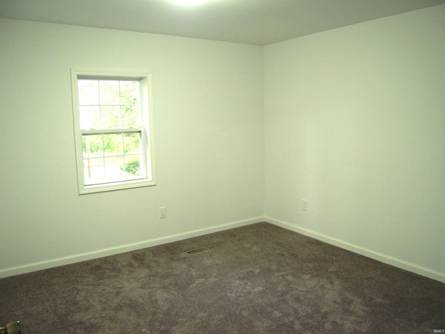 25123 Snyder St, Elkhart, IN 46514 - unfurnished room featuring dark carpet and baseboards