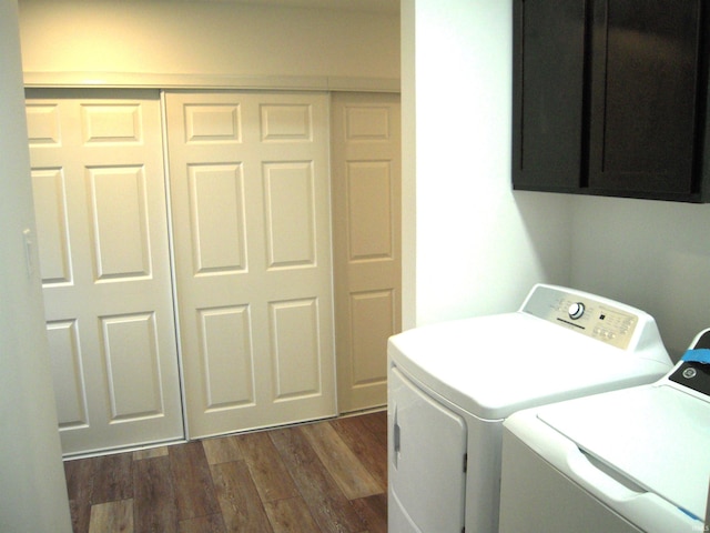 25123 Snyder St, Elkhart, IN 46514 - laundry area with cabinet space, washer and clothes dryer, and dark wood-style flooring