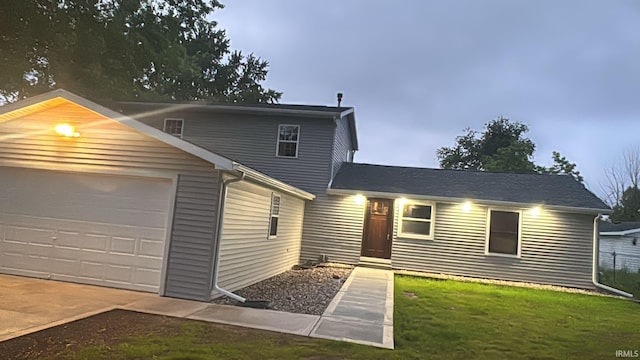 25123 Snyder St, Elkhart, IN 46514 - view of front facade with a garage and a front lawn