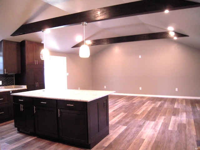 25123 Snyder St, Elkhart, IN 46514 - kitchen with wood finished floors, pendant lighting, backsplash, and baseboards
