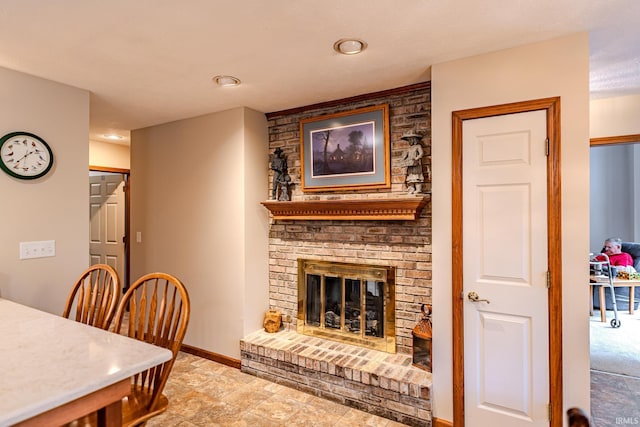 70 Mayflower Ct, Lafayette, IN 47909 - living room with a fireplace, baseboards, and recessed lighting