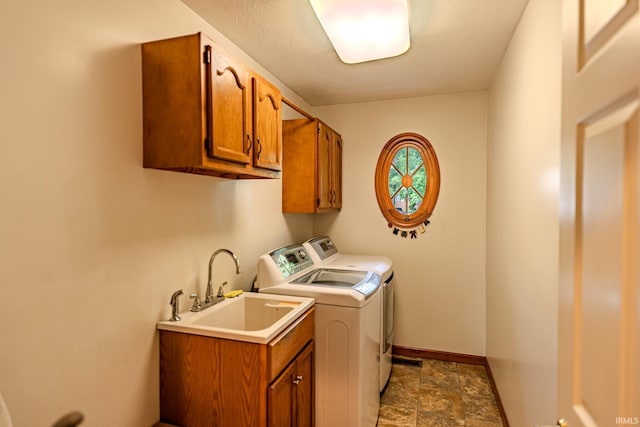 70 Mayflower Ct, Lafayette, IN 47909 - laundry room featuring cabinet space, washing machine and clothes dryer, stone finish floors, and baseboards