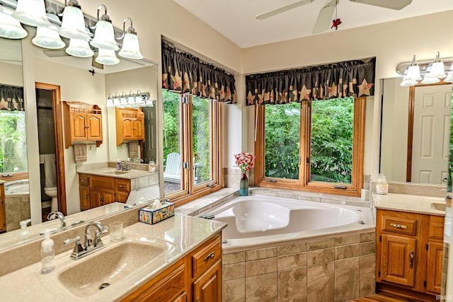 70 Mayflower Ct, Lafayette, IN 47909 - full bath with a bath, two vanities, toilet, and a ceiling fan