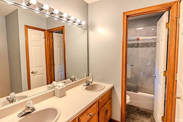 70 Mayflower Ct, Lafayette, IN 47909 - bathroom featuring double vanity, wood finished floors, toilet, and enclosed tub / shower combo