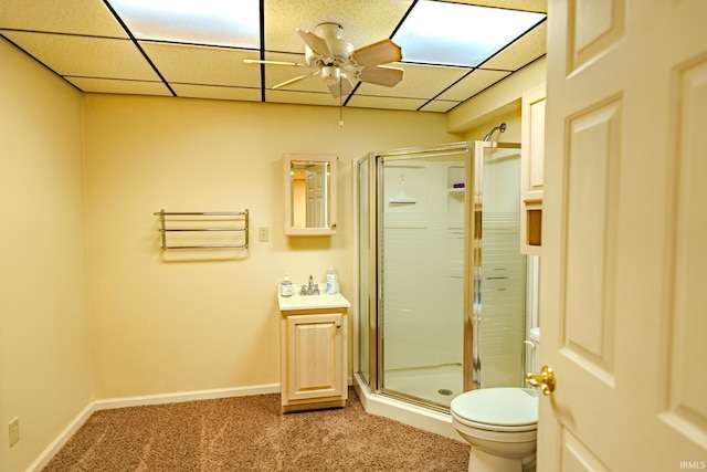 70 Mayflower Ct, Lafayette, IN 47909 - bathroom featuring a ceiling fan, a shower stall, toilet, vanity, and a paneled ceiling