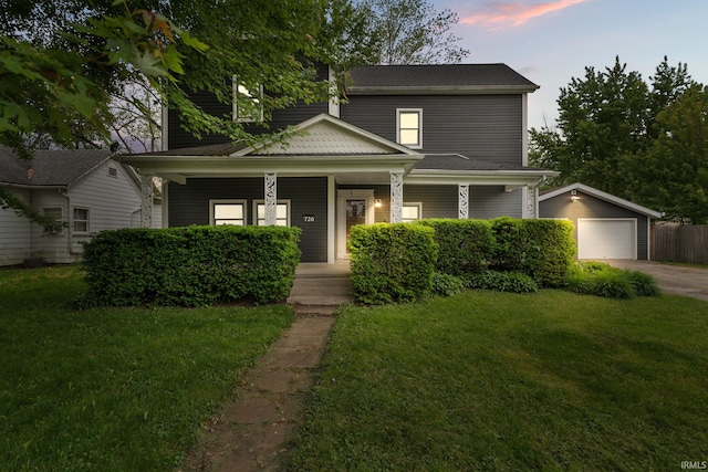 726 S Johnson, Bluffton, IN 46714 - view of front of property featuring covered porch, a garage, an outdoor structure, and a front lawn