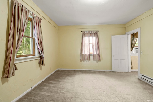 726 S Johnson, Bluffton, IN 46714 - empty room featuring carpet, healthy amount of natural light, baseboards, and cooling unit