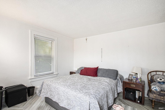 1224 N Main St, Elkhart, IN 46514 - bedroom featuring wood finished floors and a textured ceiling