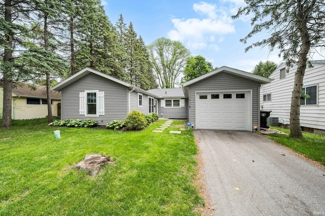 1718 Churchill Dr, South Bend, IN 46617 - ranch-style house with asphalt driveway, a garage, and a front yard