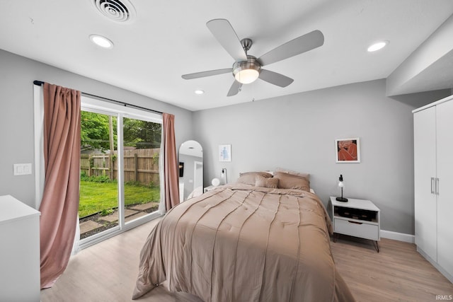 1718 Churchill Dr, South Bend, IN 46617 - bedroom with access to exterior, light wood-style floors, recessed lighting, a ceiling fan, and baseboards