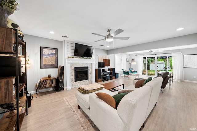 1718 Churchill Dr, South Bend, IN 46617 - living area featuring a ceiling fan, light wood-style flooring, baseboards, a stone fireplace, and recessed lighting