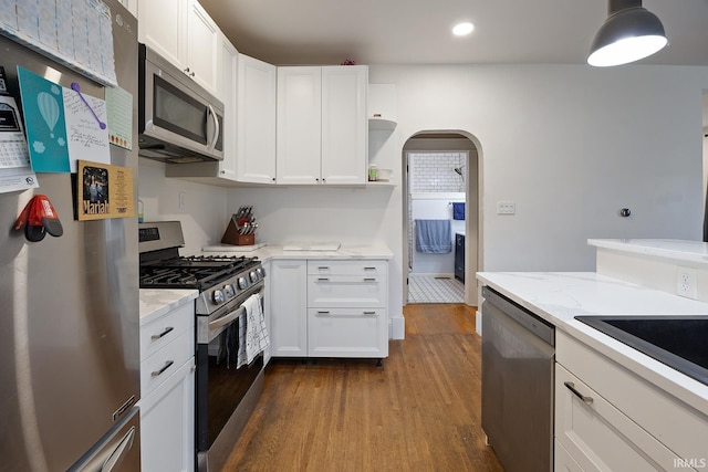 1413 Franklin St, Lafayette, IN 47905 - kitchen featuring appliances with stainless steel finishes, dark wood finished floors, recessed lighting, white cabinets, and light stone counters
