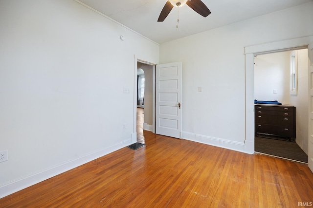 1413 Franklin St, Lafayette, IN 47905 - unfurnished bedroom with light wood-style flooring, baseboards, and ceiling fan