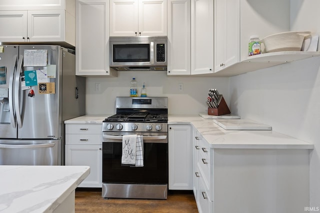 1413 Franklin St, Lafayette, IN 47905 - kitchen featuring appliances with stainless steel finishes, white cabinetry, dark wood finished floors, and open shelves