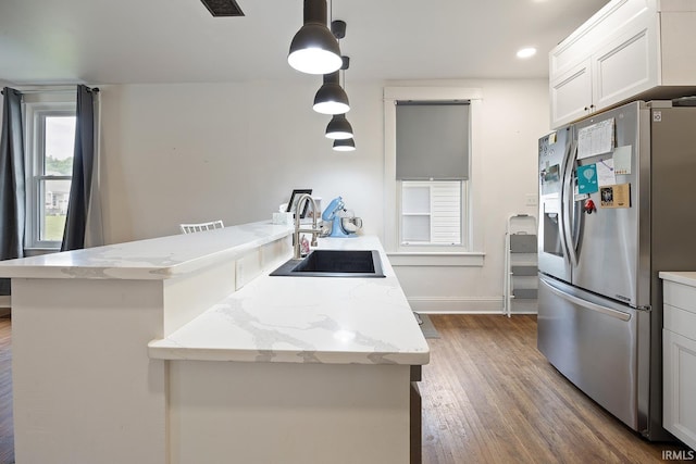 1413 Franklin St, Lafayette, IN 47905 - kitchen with stainless steel fridge, a sink, a peninsula, dark wood-type flooring, and recessed lighting